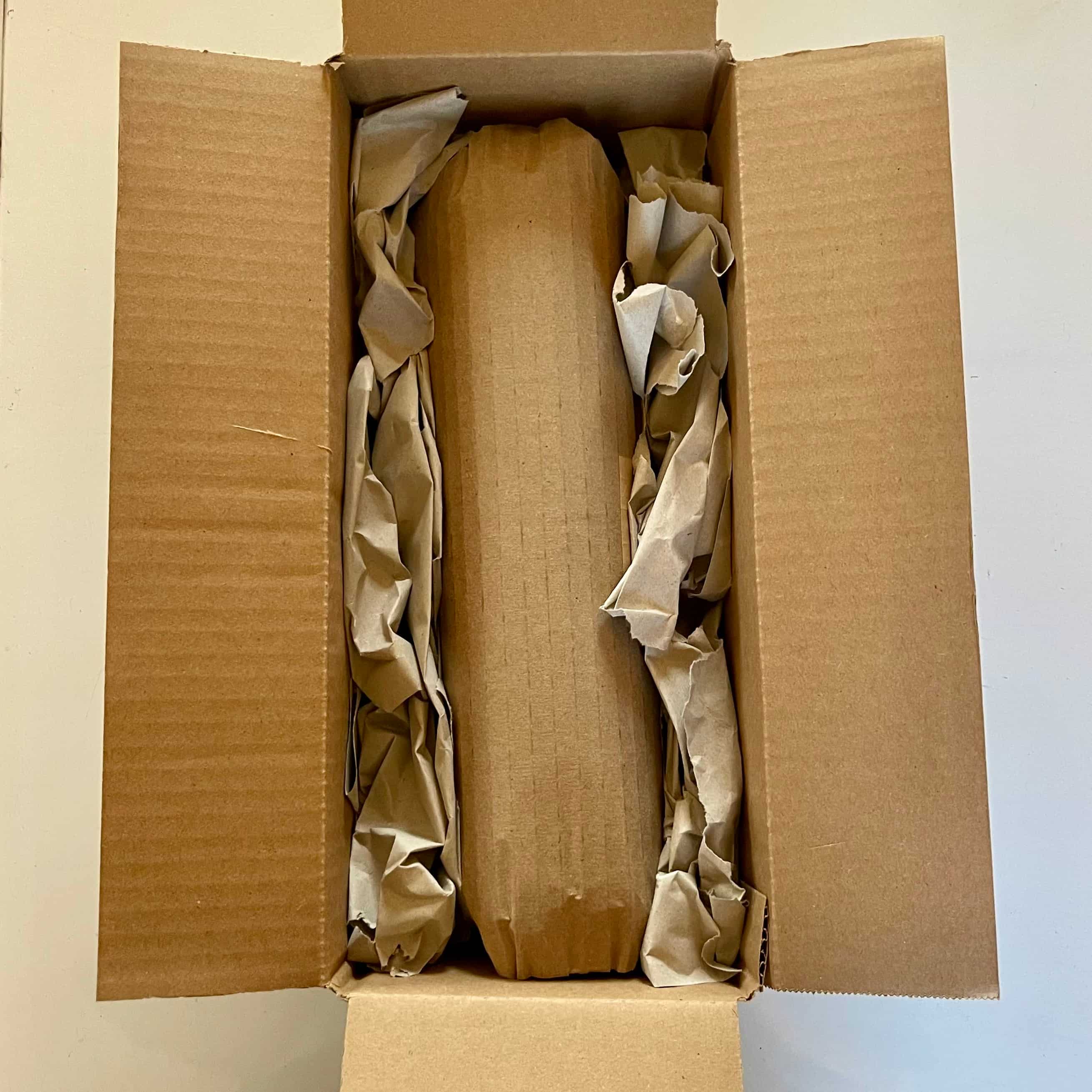 San Pedro cactus cutting packed bare-root in an open shipping box